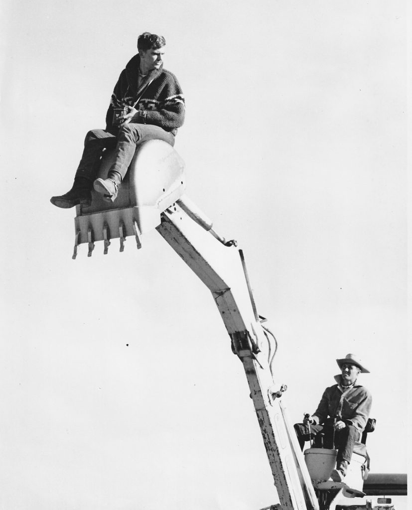 Karl Kernberger with camera sitting on an excavator